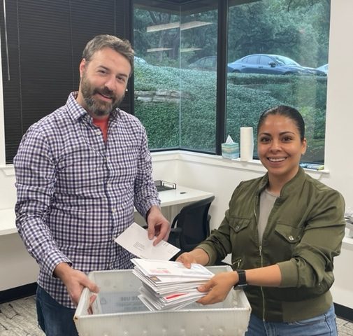 Two employees of Texan Registered Agent LLC collect mail for business owners in Texas.