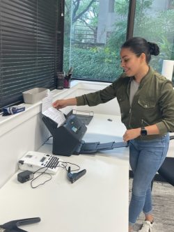 An employee of Texas Registered Agent scans a document in the office in Austin, Texas.