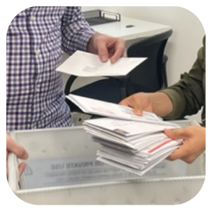 Registered agents with Texan Registered Agent LLC sort through mail.